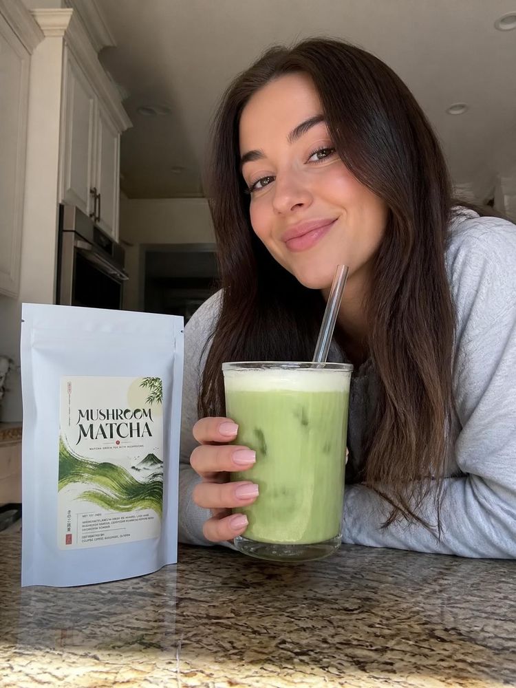 Customer holding three bags of mushroom matcha